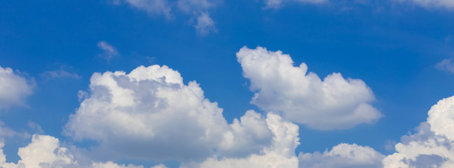 Naklejka na ściany i meble Banner white clouds against a blue sky