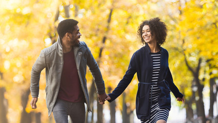 Loving couple having fun in autumn park