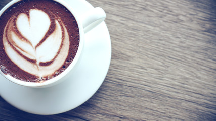 The late art on top  Coffee cup .it put on wood table    