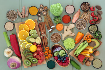 Health food for liver detox concept with fresh fruit, vegetables, nuts, seeds, supplement powders with herbs and spices used in herbal medicine. Foods high in antioxidants, vitamins & dietary fibre. 