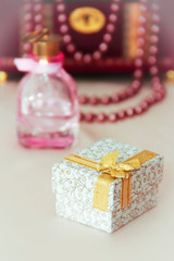 gift box with patterns and a yellow bow on a decorative background