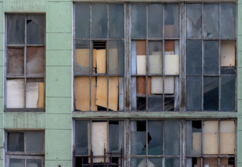 Abandoned Building with broken Windows, window with broken glass, old industrial building