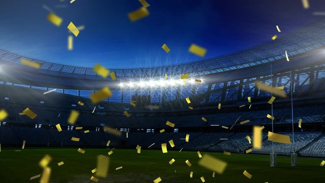 Golden confetti falling down in front of a sports stadium