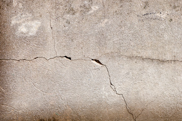 Fissure, crevasse dans le mur en béton, texture et arrière-plan 