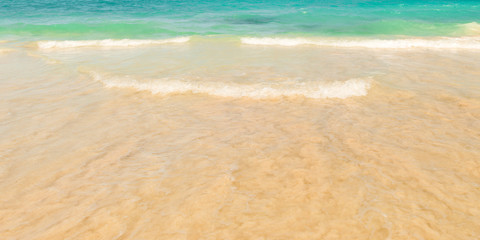 Fototapeta na wymiar The texture of the sea wave on the sand