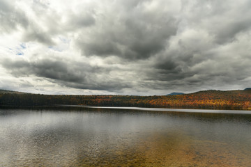 A lake among mountains covered with forests. autumn landscape . White Mountain National Park. USA. New Hamshire.