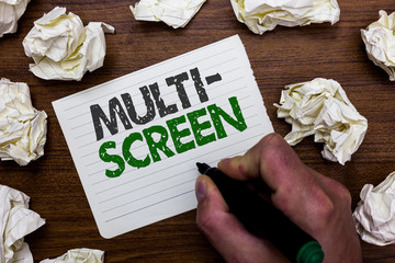 Conceptual hand writing showing Multi Screen. Business photo showcasing Having or involving several screen especially in a cinema Man holding marker notebook page crumpled papers mistakes