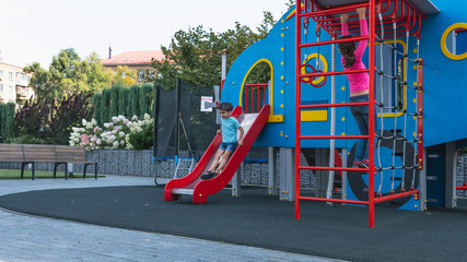 Happy smiling child on playground. Happy kids playing outdoors