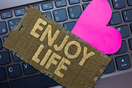 Conceptual hand writing showing Enjoy Life. Business photo text Any thing, place,food or person, that makes you relax and happy Paperboard Romantic lovely message Heart Keyboard Type computer