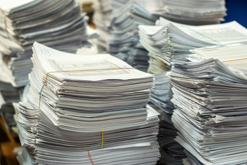 pile of paper documents in the office
