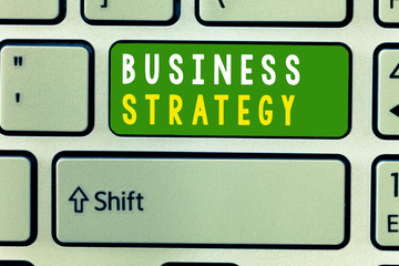 Fototapeta premium Handwriting text Business Strategy. Concept meaning Management game plan to achieve desired goal or objective.