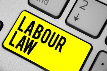Word writing text Labour Law. Business concept for Rules implemented by the state between employers and employee Keyboard yellow key Intention create computer computing reflection document