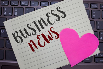 Conceptual hand writing showing Business News. Business photo showcasing Commercial Notice Trade Report Market Update Corporate Insight Notebook paper keyboard Romantic Lovely ideas Type computer