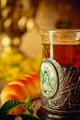 A glass of tea with thyme