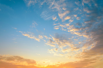 Beautiful sunrise. Blue and orange sky with dramatic clouds.