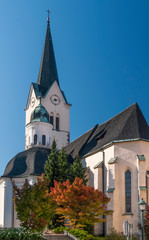 Fototapeta na wymiar The beautiful Parish Church of St. George in Slovenske Konjice, Slovenia, on a sunny day and blue sky