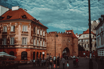 Entrance to Warsaw city Barbican, houses Old and New Town. Travel to Poland. Tourism explore concept. Polish architecture. City tour. Urban landscape. Street view. Europe sightseeing background.