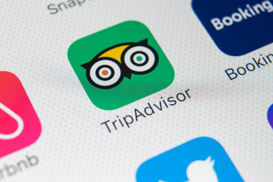 Sankt-Petersburg, Russia, February 9, 2018: Tripadvisor application icon on Apple iPhone X screen close-up. Tripadvisor.com app icon. Tripadvisor is an online travel website. Social media app