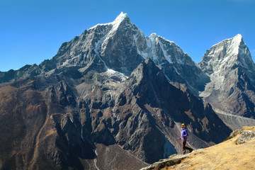 Happy man Traveler hiking in Himalayas with Everest mountain background. mountaineering sport lifestyle concept