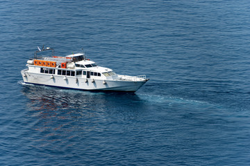 White ferry boat in the blue Mediterranean Sea. port of Vernazza, Cinque Terre, Liguria, Italy, south Europe