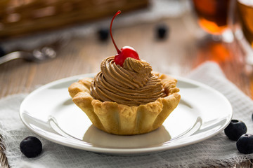 chocolate cream cake with cherry