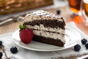 Sweet cream cake on a plate with strawberry