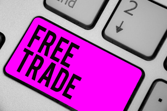 Text sign showing Free Trade. Conceptual photo The ability to buy and sell on your own terms and means Keyboard purple key Intention create computer computing reflection document