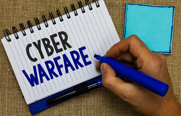 Word writing text Cyber Warfare. Business concept for Virtual War Hackers System Attacks Digital...