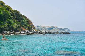 View of the town of Tropea from a nearby beach called a paradise of divers in the south of Italy - obrazy, fototapety, plakaty