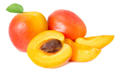 apricot fruits with slices and green leaf isolated on white background