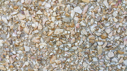 surface structure created by spraying, sand sifted painted crimson and cream small stones, gravel walls, building facades, the largest texture