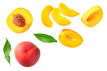 peach fruit with green leaf and slices isolated on white background. top view