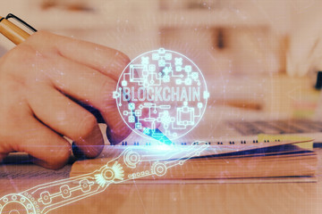 Man's hands working with notes background. Cryptocurrency and finance concept.