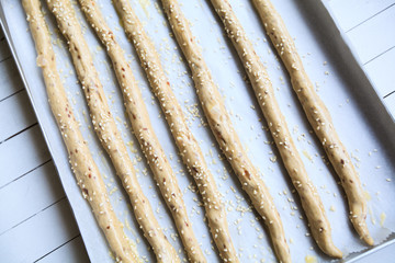 Unbaked homemade bread spelt sticks