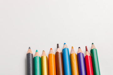 spectacles and color pencil on white background  