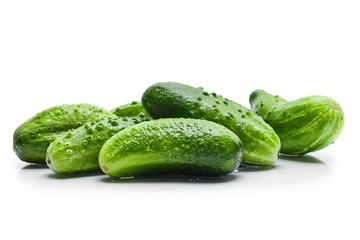 Fresh wet cucumbers isolated on white