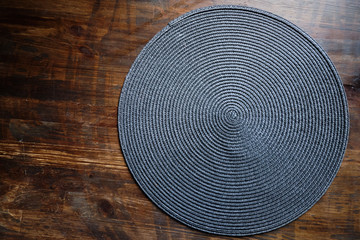 Wicker stand for hot food on a wooden table