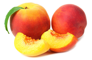 peach fruit with green leaves and slices isolated on white background