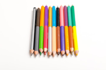 Fototapeta premium The concept of the teacher's day, School stationery, pencil, pen, note, Spectacles, tie in pen box on white background