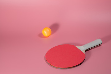 Table tennis or ping pong Sport concept . Two Rackets and ball on Pink background . Indoor sport activity.