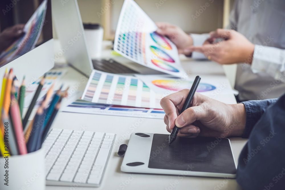 Aufkleber two colleague creative graphic designer working on color selection and color swatches, drawing on gr