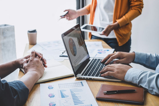 Business team collaboration discussing working analyzing with financial data and marketing growth report graph in team, presentation and brainstorming to strategy planning making profit of company