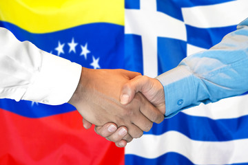Business handshake on the background of two flags. Men handshake on the background of the Venezuela and Greece flag. Support concept