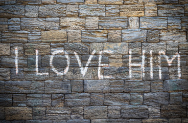 old brick wall with an inscription