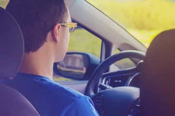 Naklejka premium Young man driving a car
