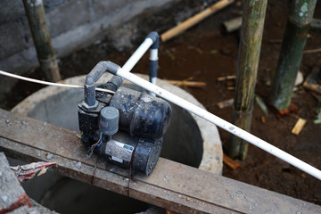 Installation of water pump on concrete well