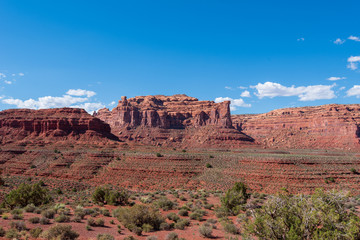 Fototapeta premium Landscape of large red buttes and monoliths at Valley of the Gods in Utah