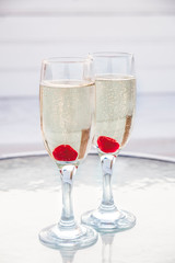 Two glasses of champagne on a table