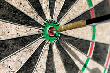 Darts with a dart at the target. Business strategy concept.