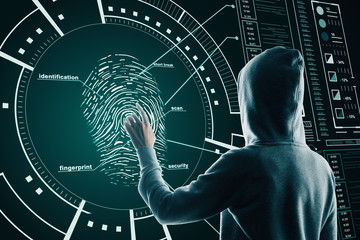 Hacking and security concept with back hacker pushing on fingerprint on cyberspace screen.